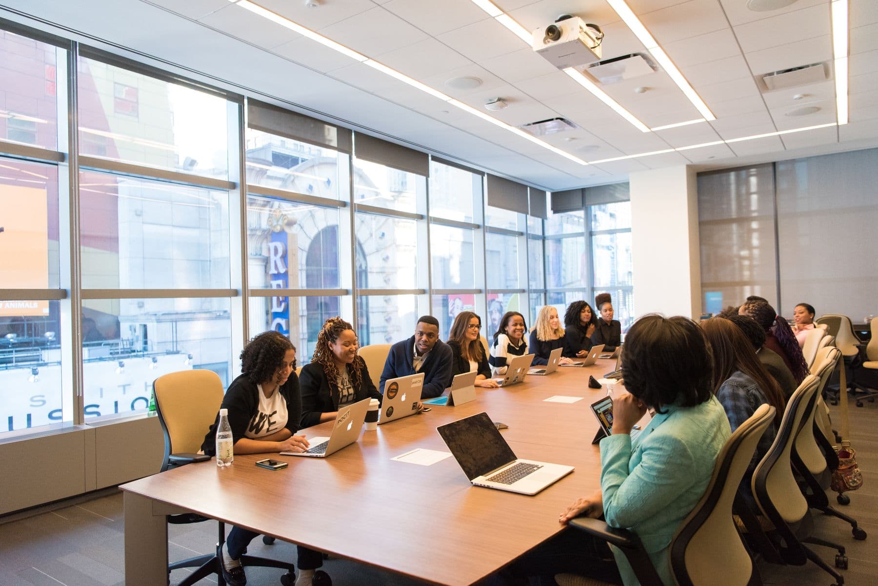 A diverse team discussing product direction around a conference table