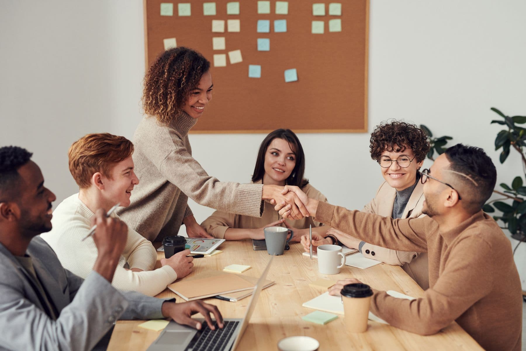 A diverse team collaborating around a shared workspace