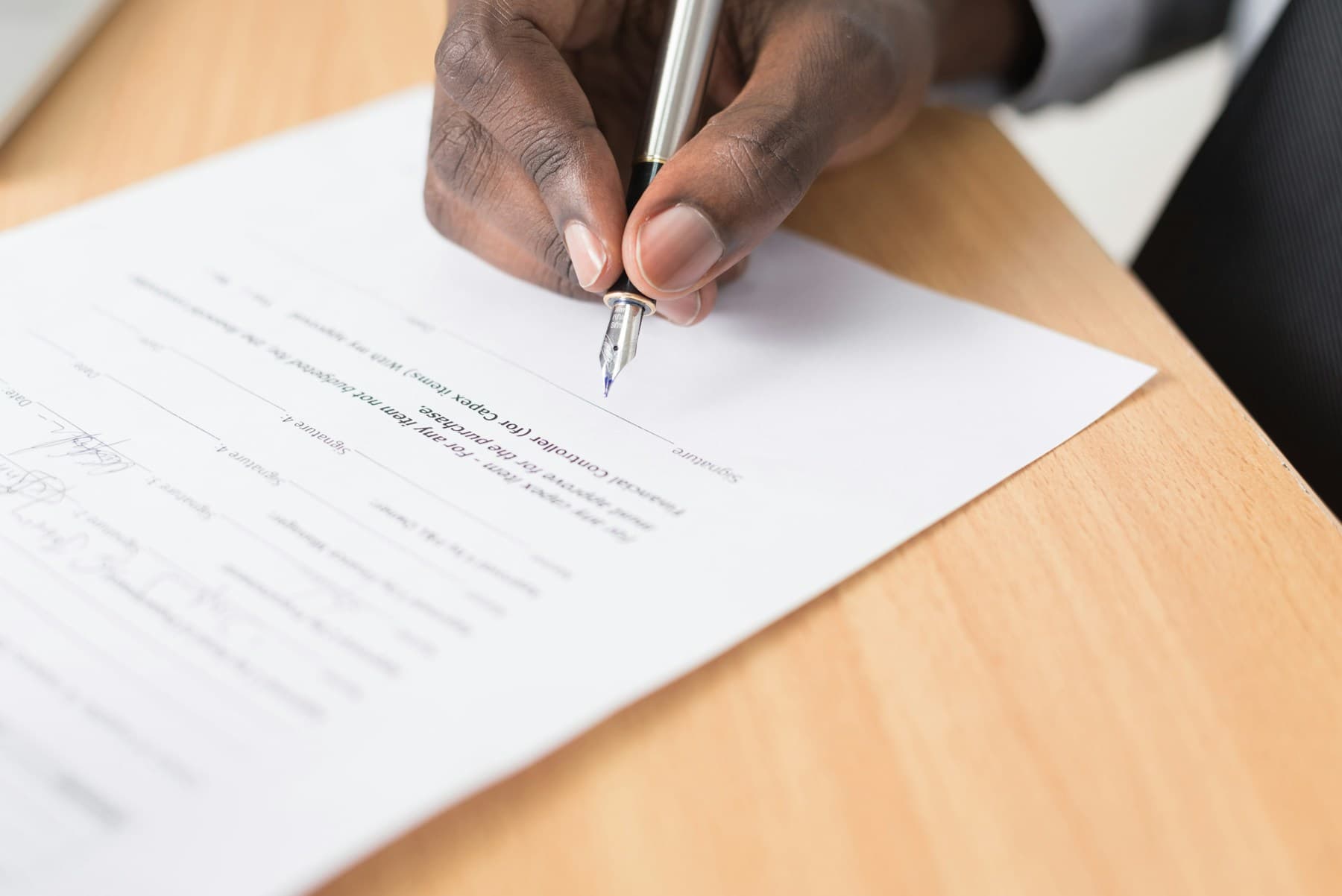 Legal professionals reviewing an agreement together